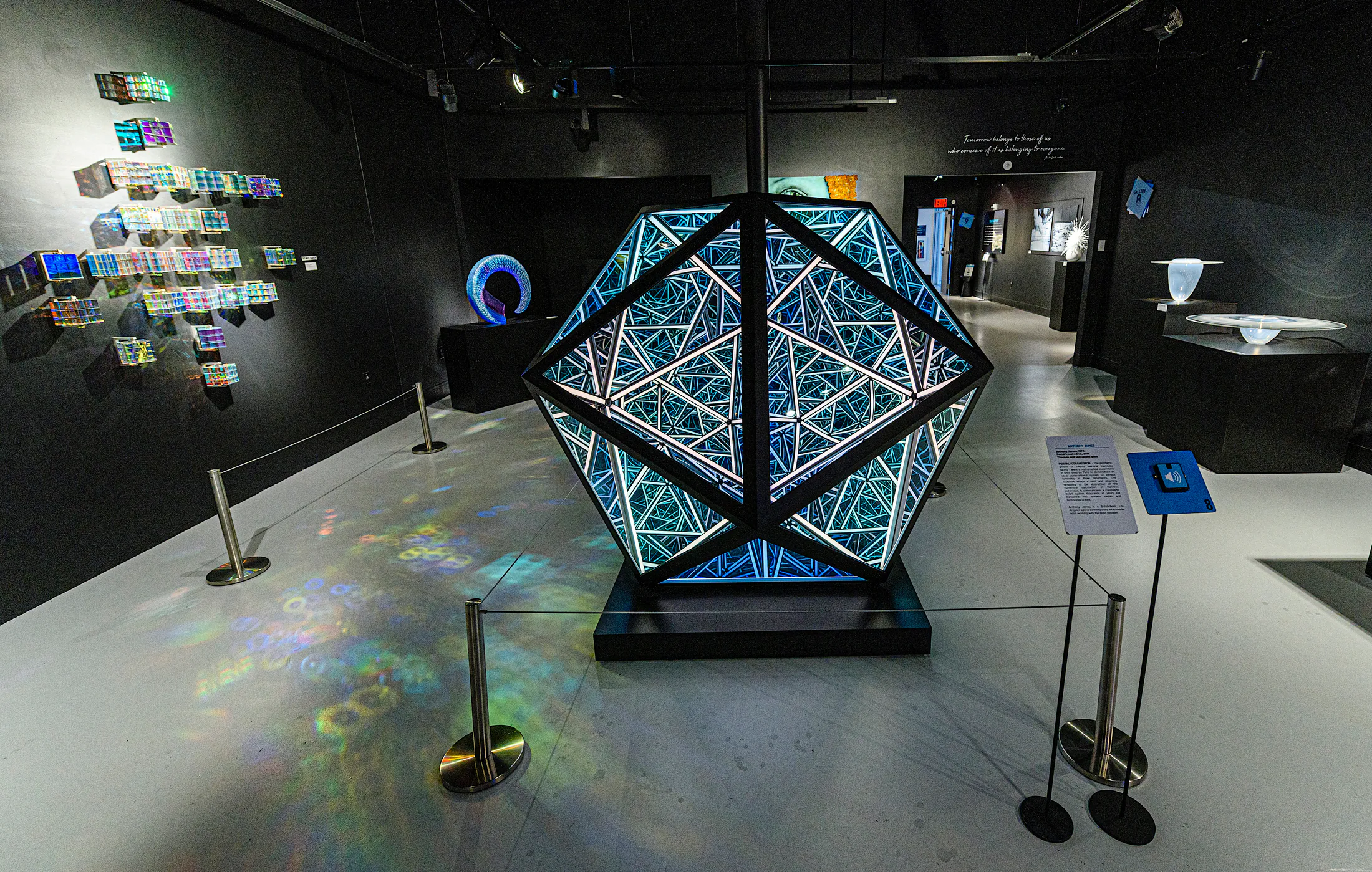 Geometric illuminated glass installation at Imagine Museum
